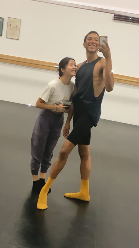 Two dancers in a studio take a selfie