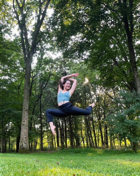 A dancer jumps outdoors