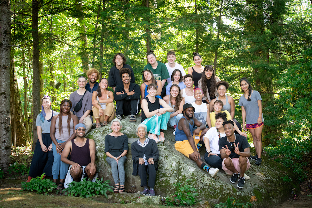 The 2022 Choreography Fellows seated on the Pillow Rock.