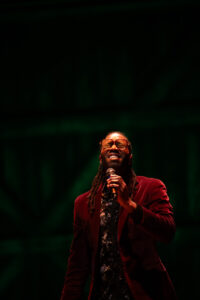Photo of a man singing in the Ted Shawn Theatre.