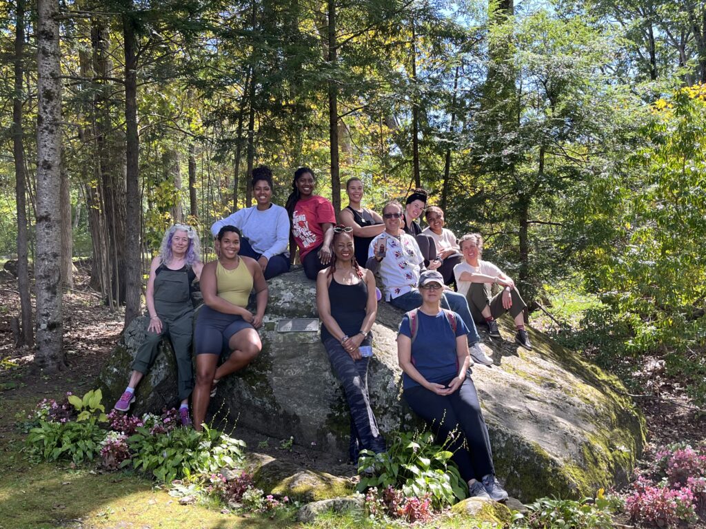 The 2023-24 Curriculum in Motion® Institute cohort on the Pillow Rock.